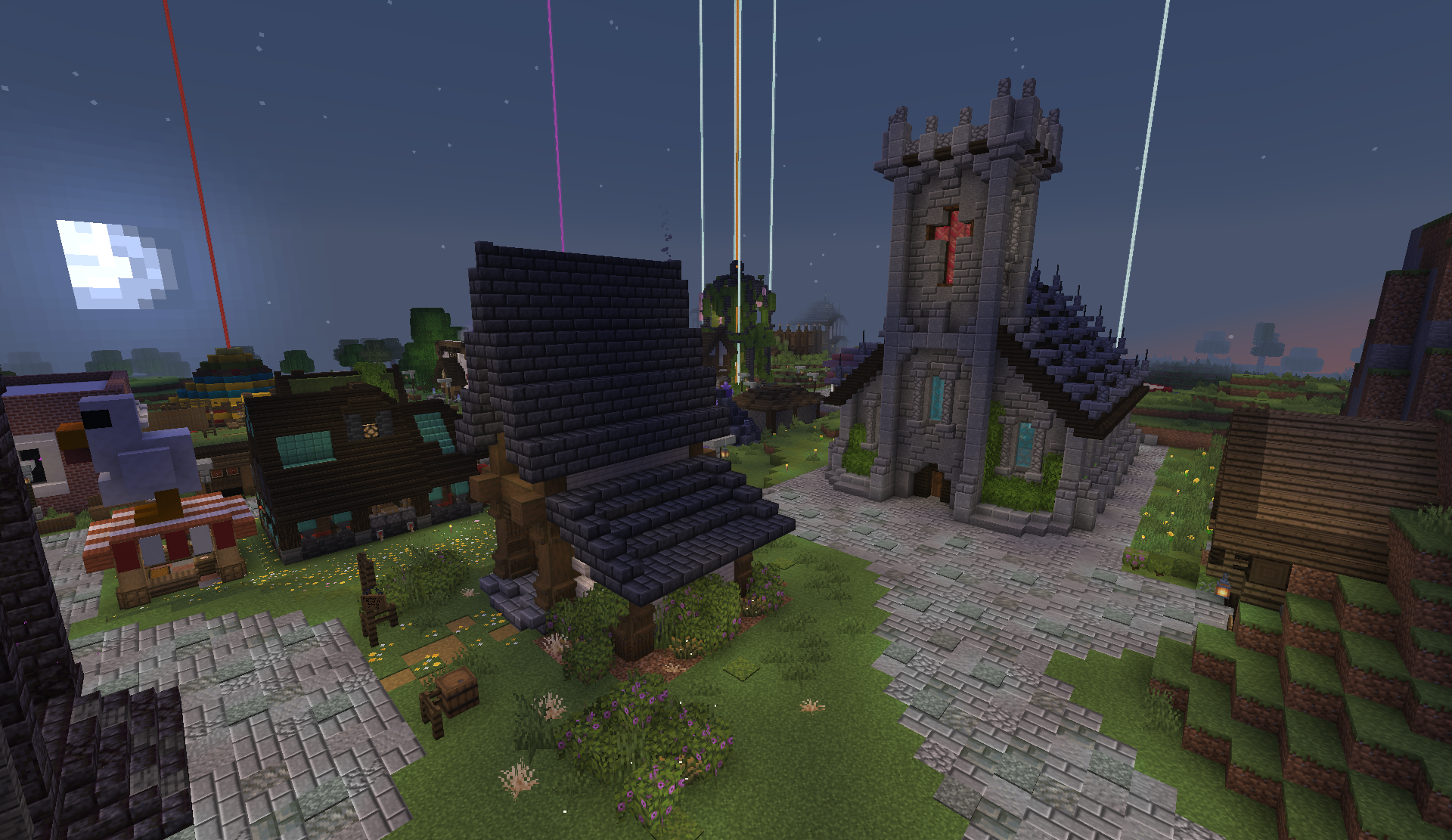 Nighttime view of the stone church and surrounding shops in the district
