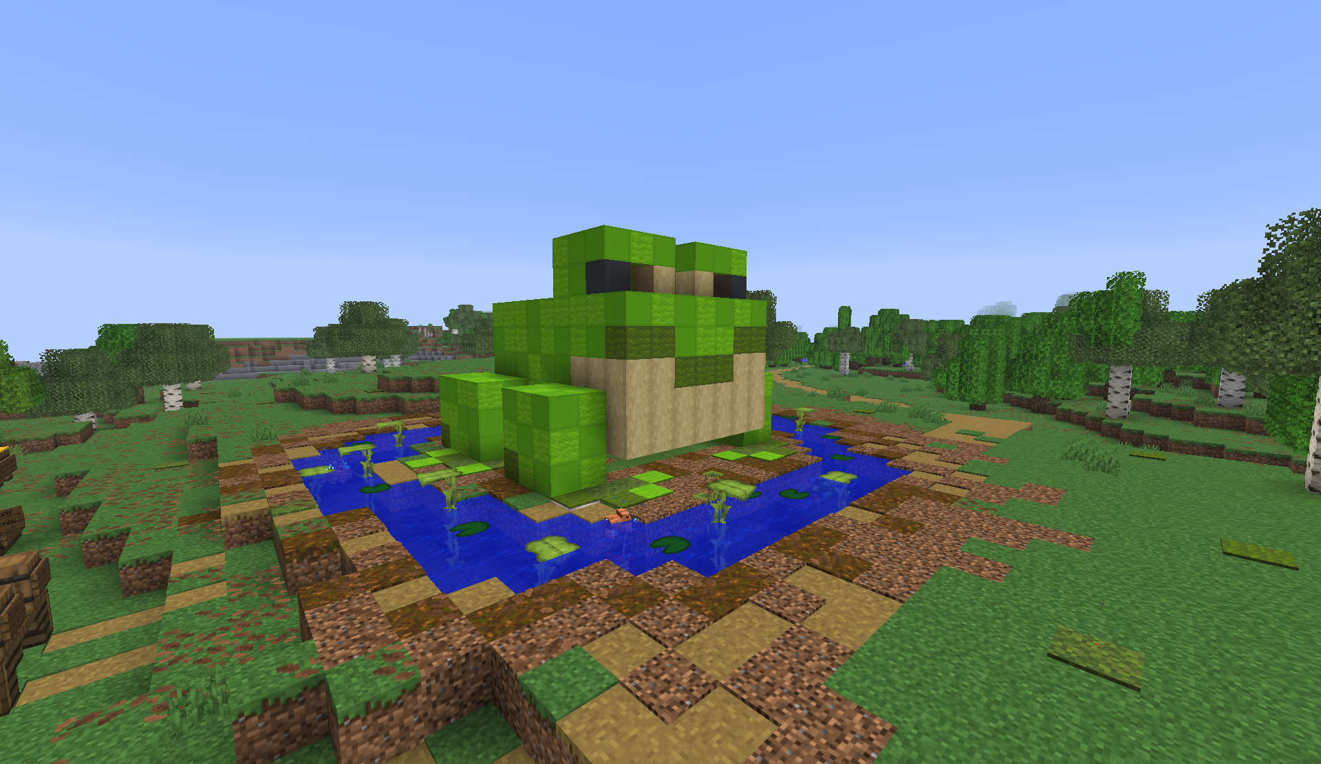 Giant frog shop sitting in a pond in the shopping district