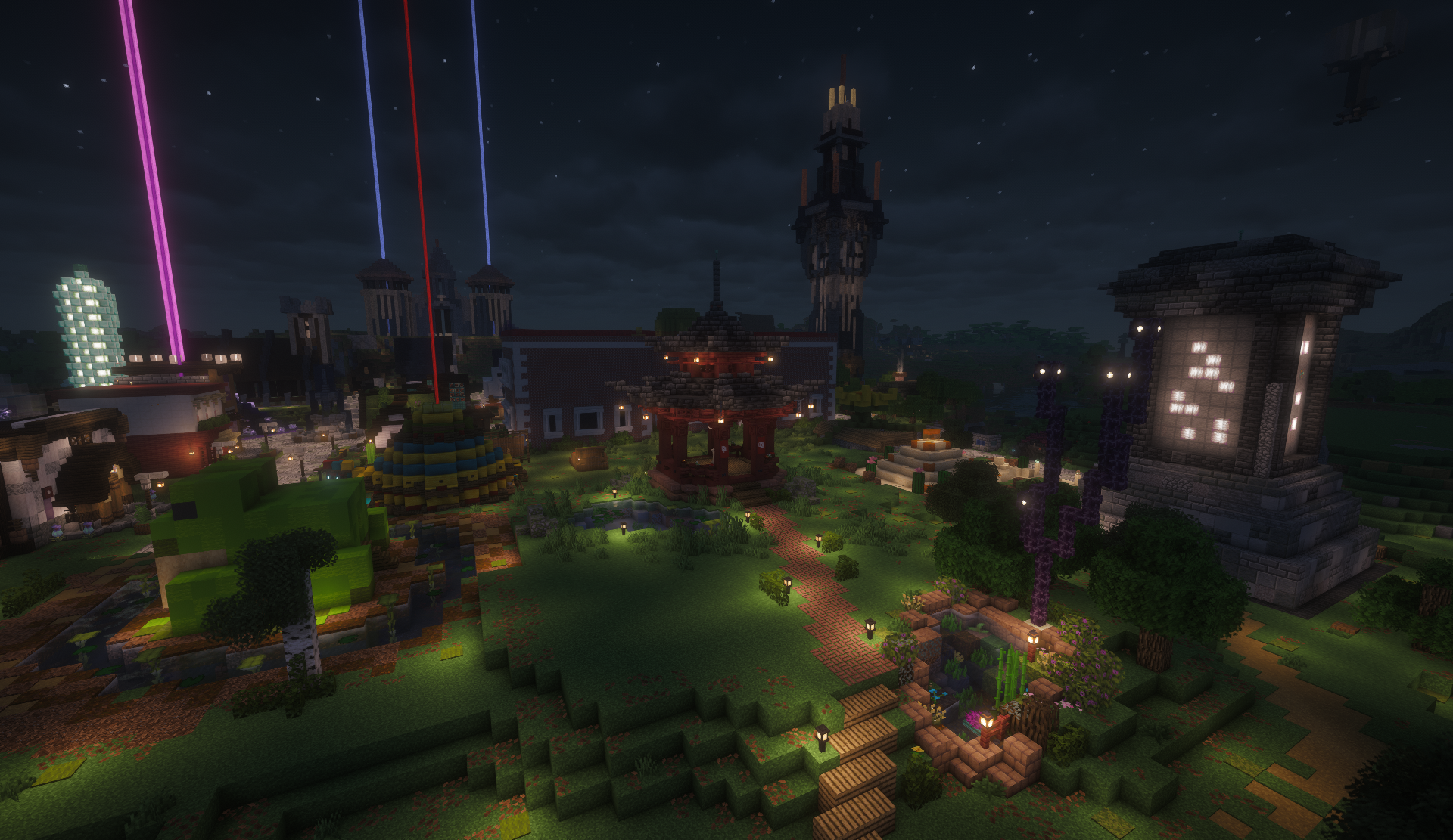 Night garden in the shopping district with a pagoda, clock tower, and glowing monument