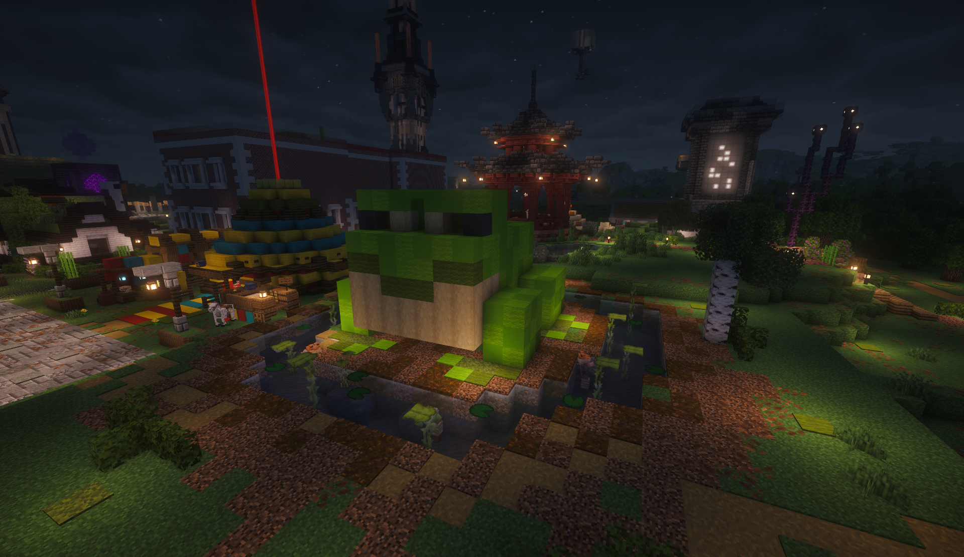 Giant frog shop sitting in a pond in the shopping district at night