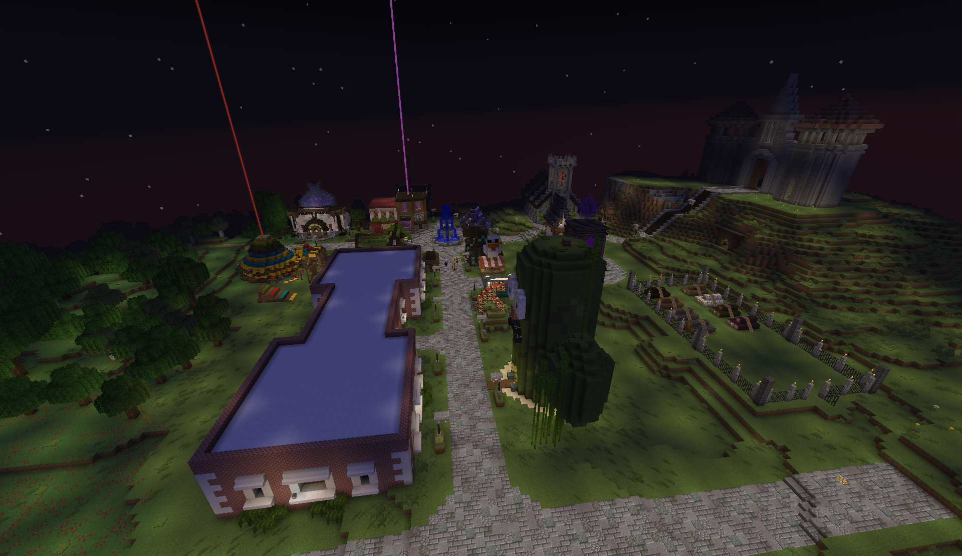 Nighttime aerial view of the shopping district with a castle on the hill