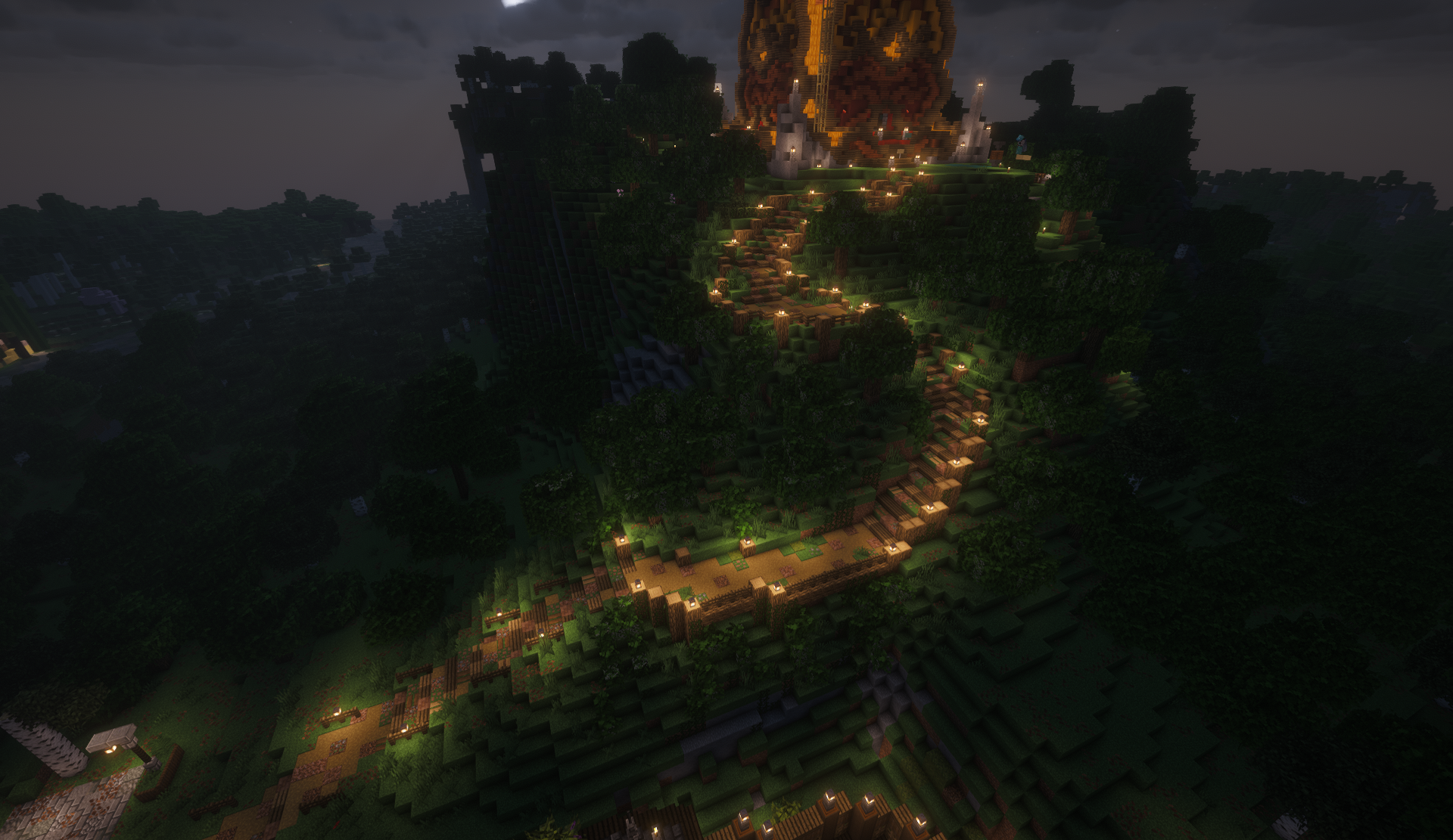 Lantern-lit mountain path winding up to a glowing summit build at night
