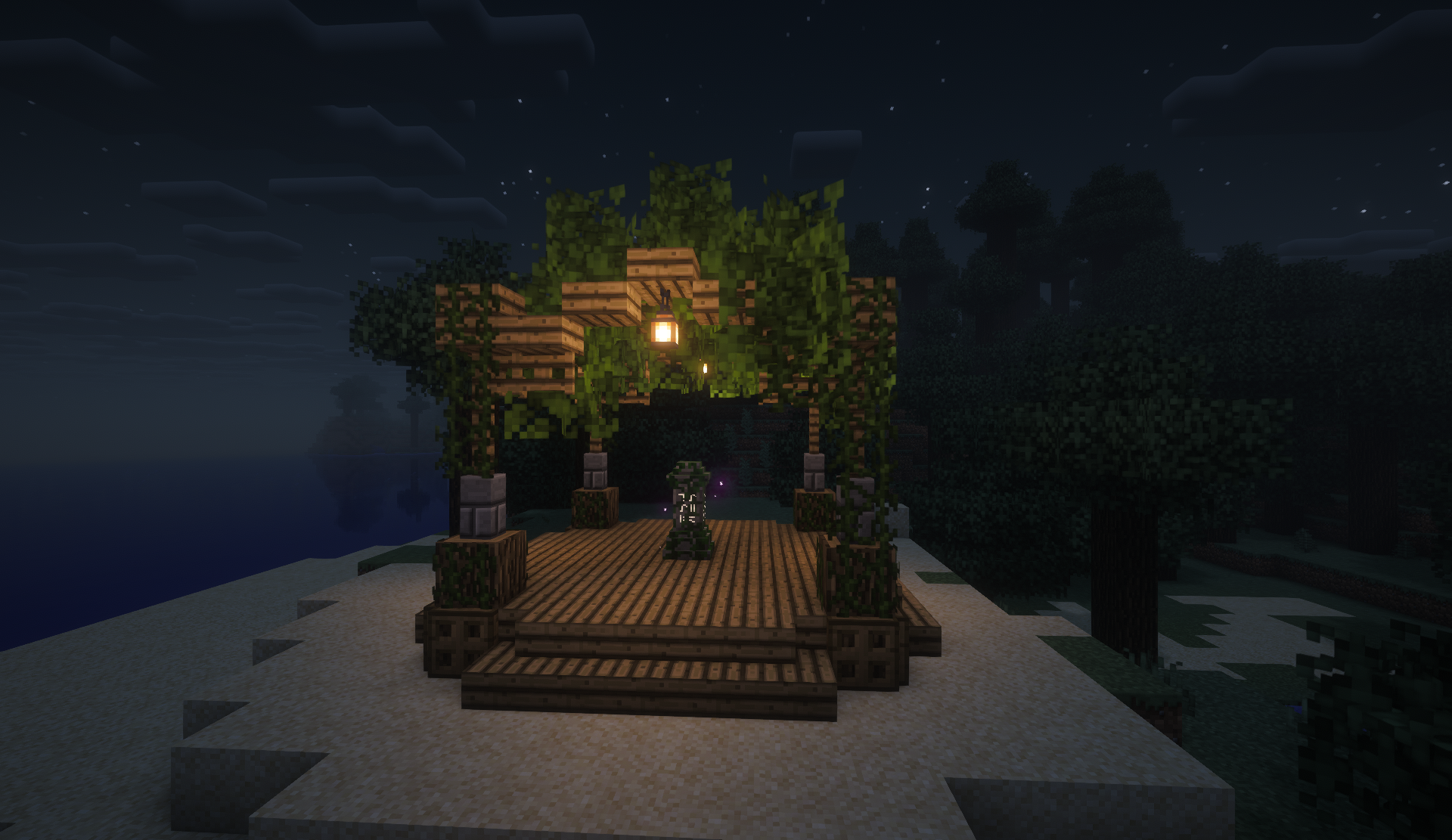 Vine-draped wooden pavilion with a waystone on a sandy shore at night