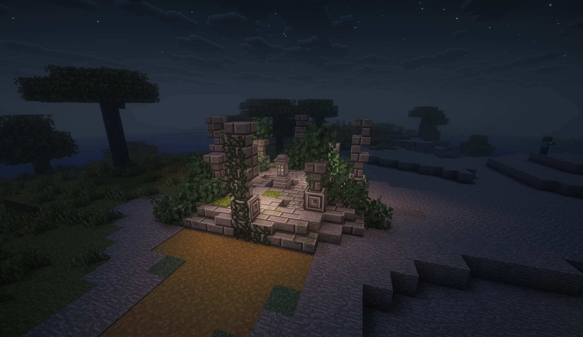 Overgrown stone ruin with a waystone beside a sandy path at night