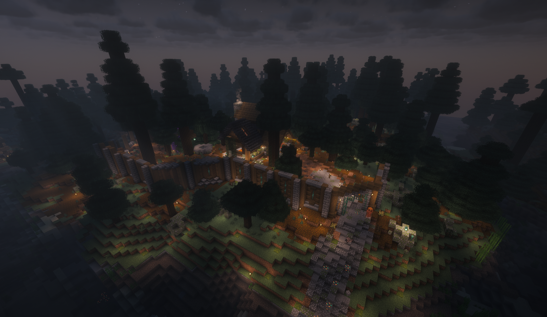 Fortified hillside base lit at night in a spruce forest