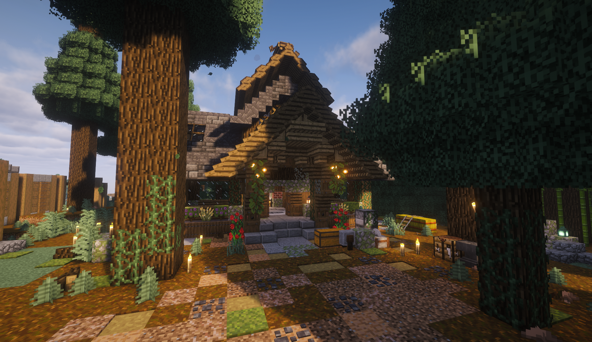 Rustic forest cottage with a thatched roof and outdoor workshop