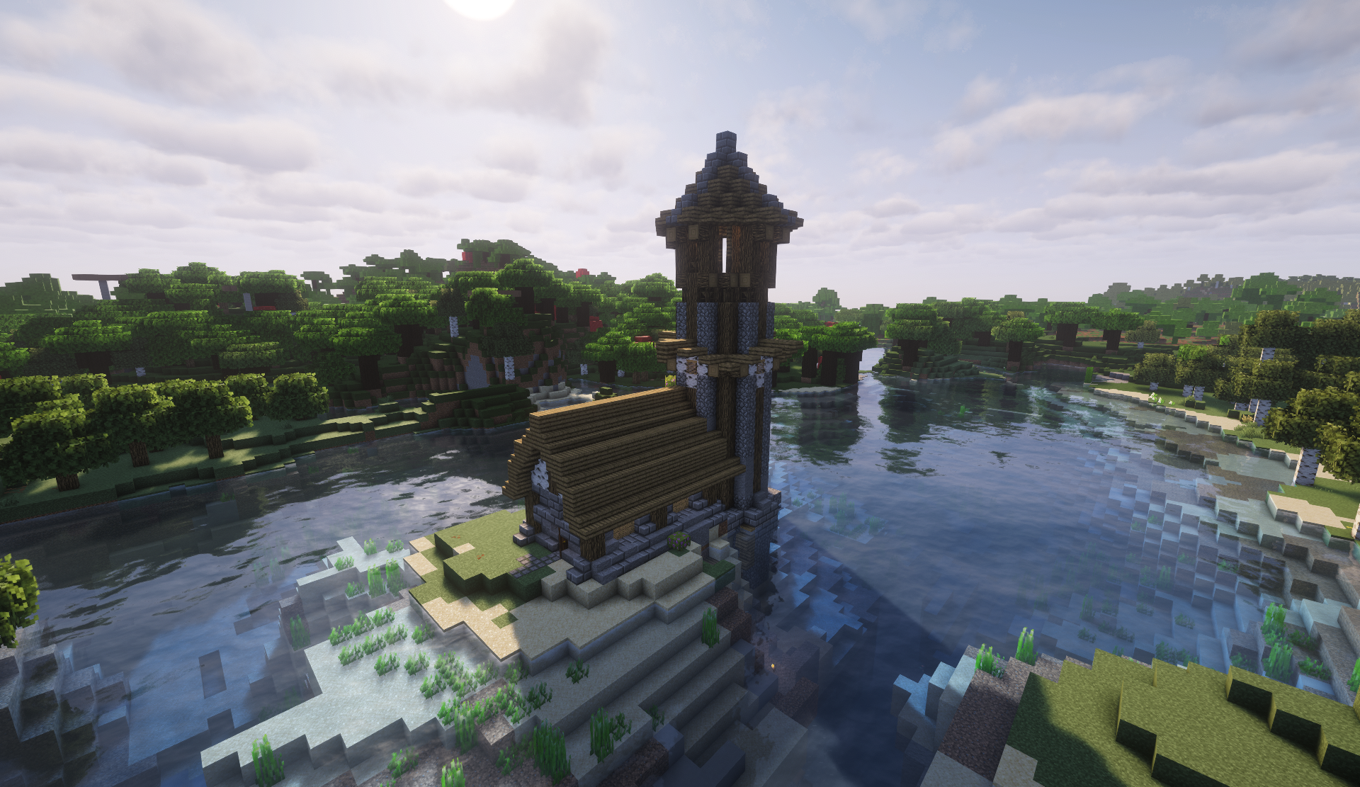 Wooden chapel with a stone-and-timber tower on a sandy river island