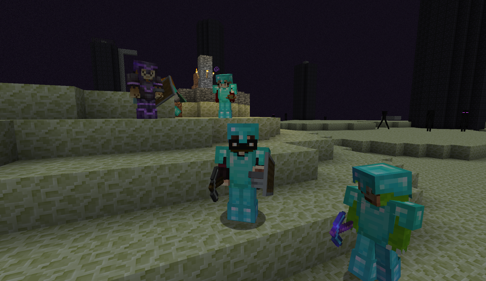 Players in diamond armor on the End island after the fight