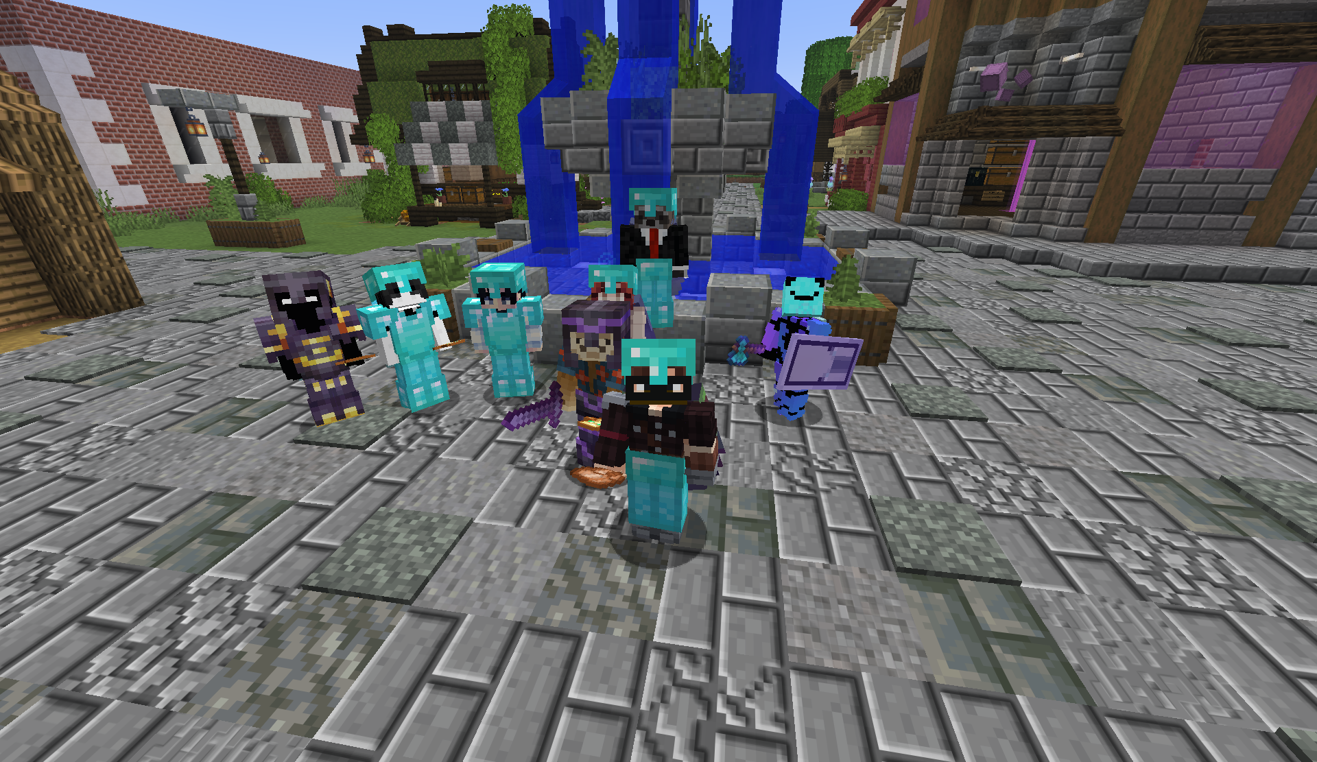 A group of players posing by the blue fountain in the Market District