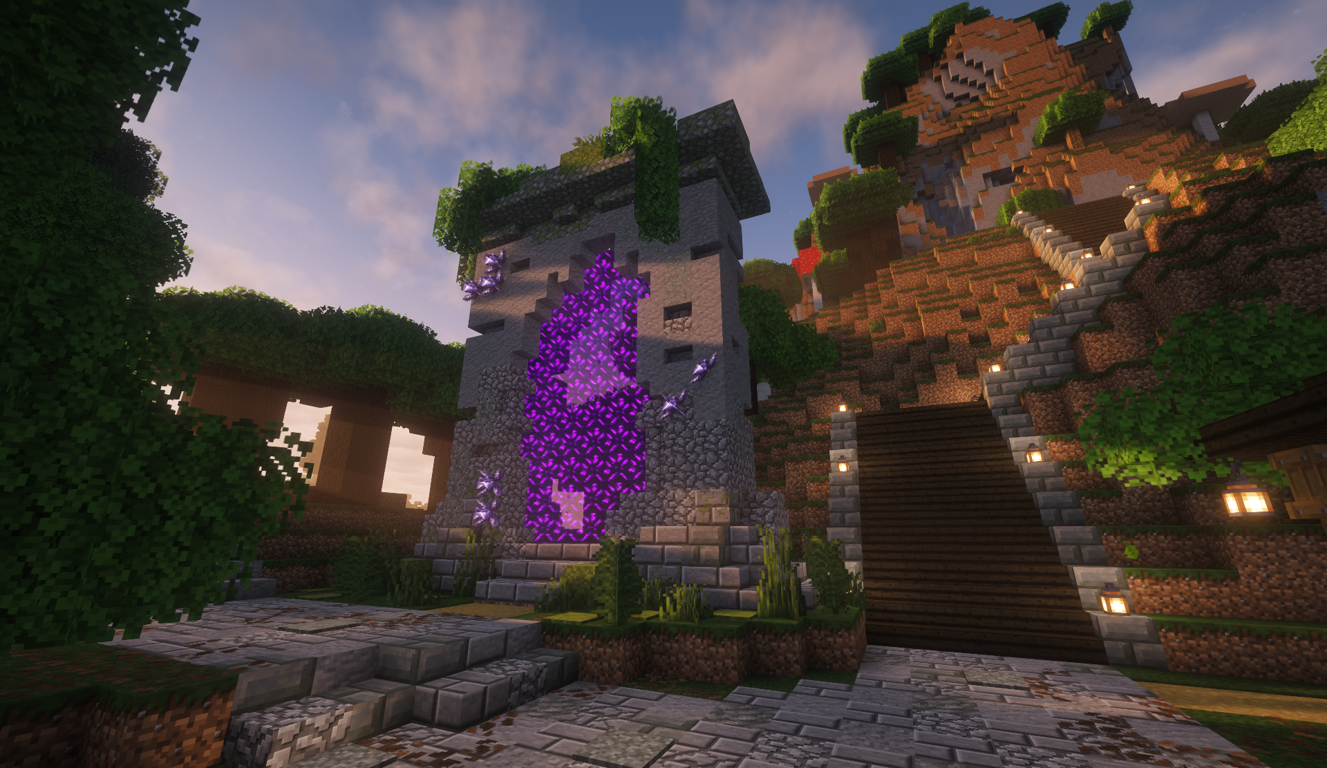 Stone nether portal tower with a glowing purple portal at the foot of a lantern-lit stairway