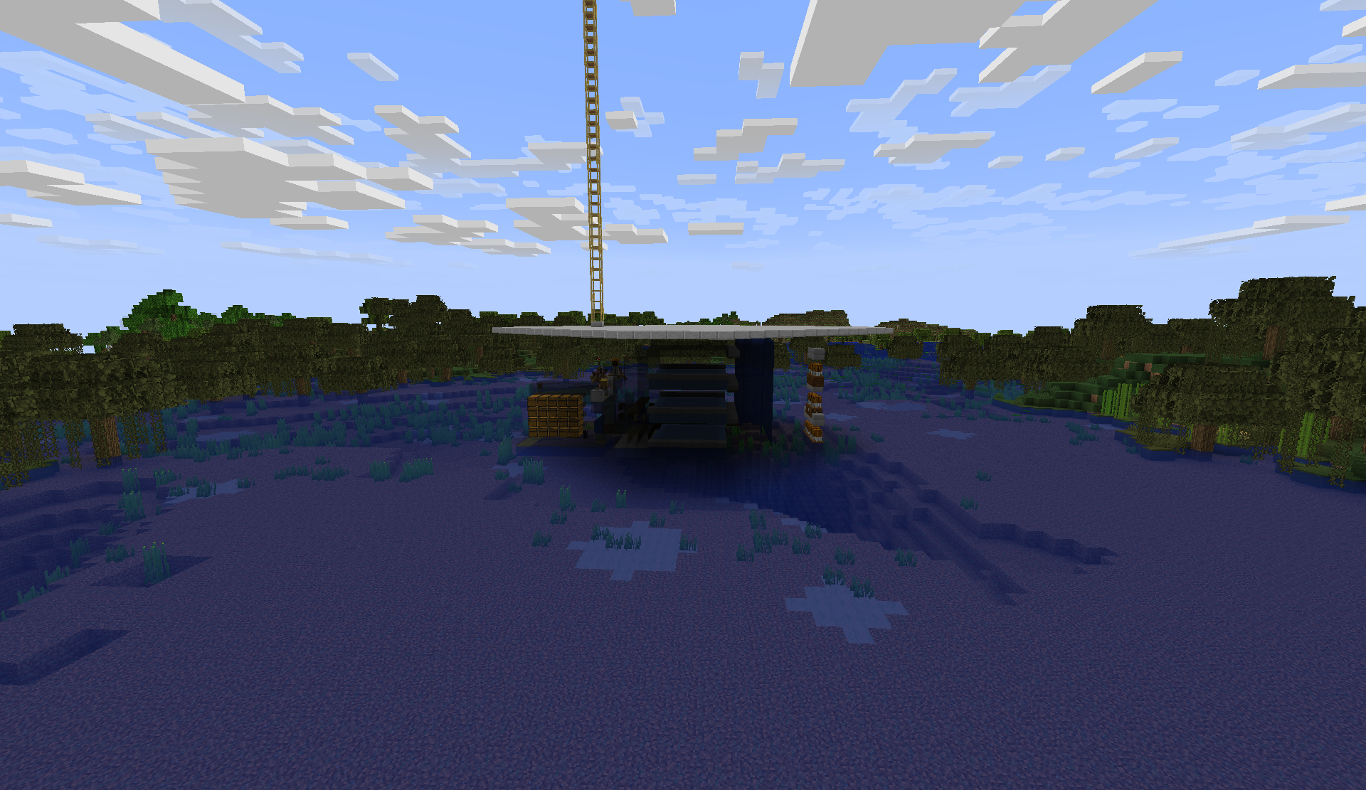 Compact factory build in a swamp, with a tall chain rising into the sky